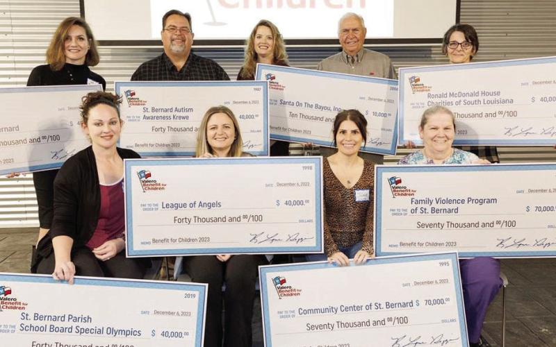Valero Meraux Refinery Vice President and General Manager Leslie Sullivan and representatives from eight local charities at the Valero Meraux Benefit for Children Check Presentation Event.