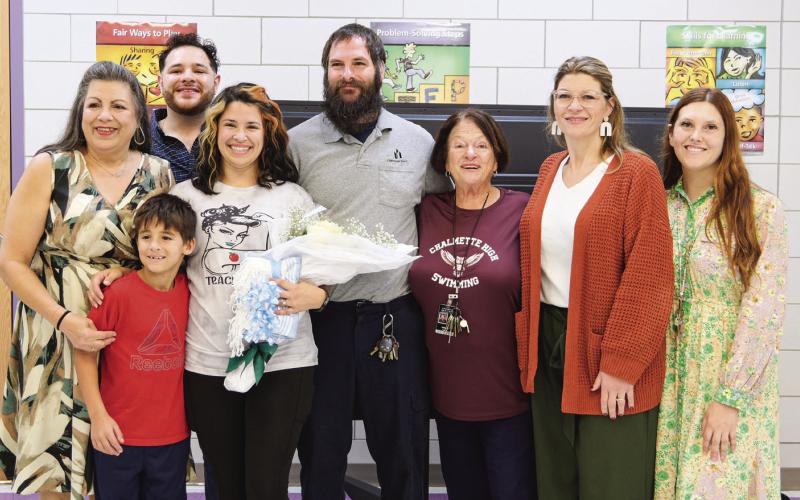 From left to right, back row: Renee Easley, Part-Time Justin, Paige Tortorich, Darius Tortorich, Millie Soroe, Principal Natalie Albers, Assistant Principal Maggie Roussell; front row, Lucas Tortorich.
