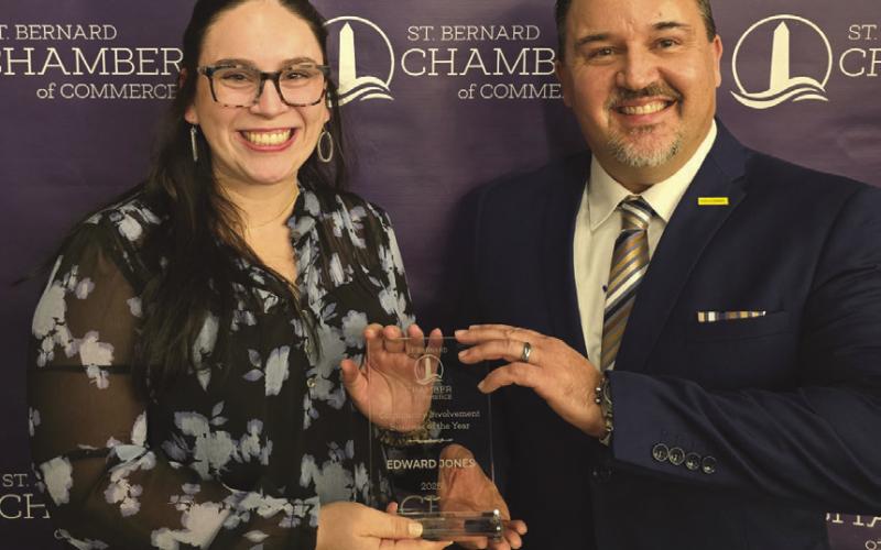 Niko Tesvich (R) and Jillian Martin (L) of Edward Jones accepting The Community Involvement Business of the Year Award.