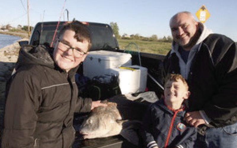 A very happy dad and sons after landing a giant 40' drum fish.
