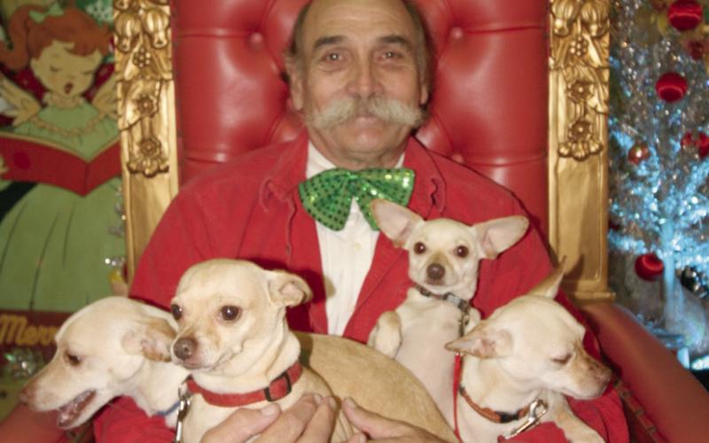 Jimmy Delery and his four-legged friends pose for a Christmas photo.