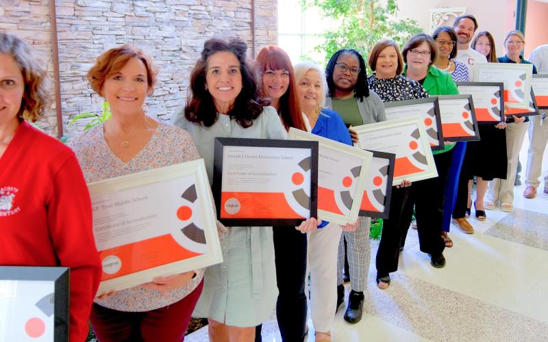 From left: Principals Heather Morel, Kara Colburn, Tiffani Glapion, Angela Siebert, Carla Carollo, Tanesha Sanchez, Lisa Young, Superintendent Doris Voitier, Cassandra Reddick, William 'Will' Schneider, Andrea Woodward, Natalie Albers and Todd Larche.