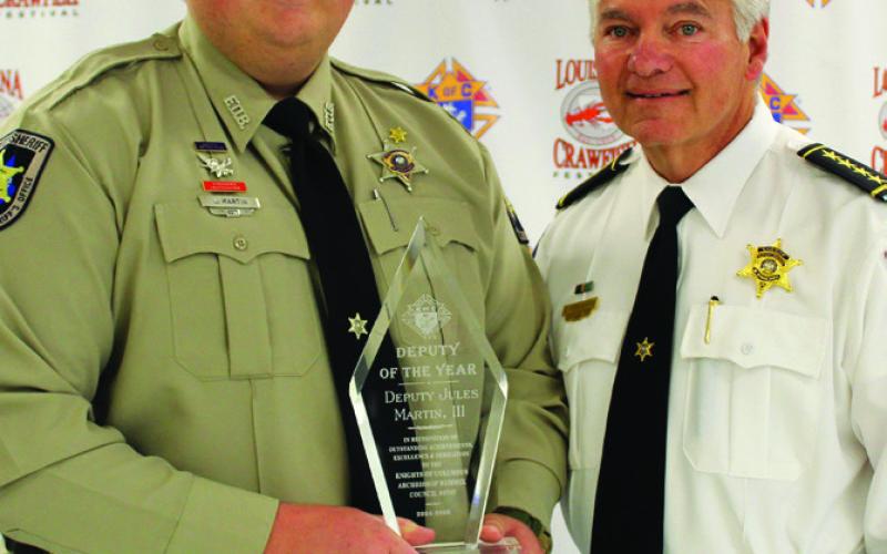 The Knights of Columbus Archbishop F. Rummel Council 5747 and its Ladies Auxiliary honored three first responders for their dedicated service during a banquet held this afternoon. Honorees are, from left: Acadian Emergency Medical Technician of the Year Jess Kingston, St. Bernard Sheriff’s Office Deputy of the Year Jules Martin III and St. Bernard Firefighter of the Year Capt. Joshua Wolfe.