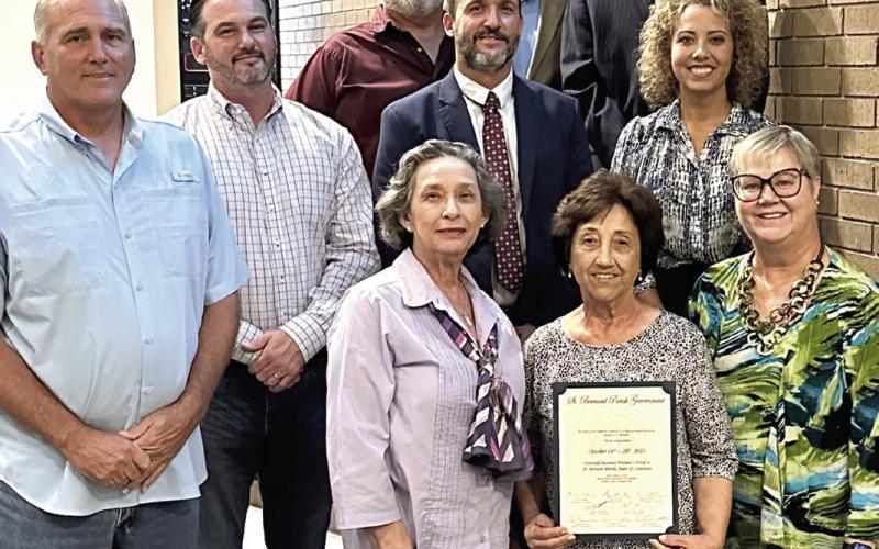 BPW members Claudette Reuther, Wanda Alcon and Deborah Fagan accept proclamation from council dedicating October 16-20 as “National Business Women's Week” in the parish.