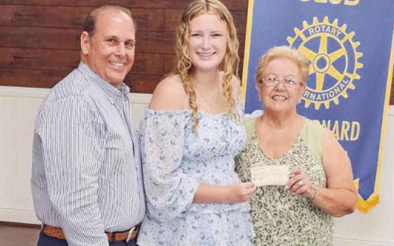 The Rotary Club presented Katie Hambrice with the Dr. Hugh Craft Rotary Club Scholarship. Pictured with Katie are Rotarian and event Emcee Joey Difatta and Club President Brenda Breakfield.