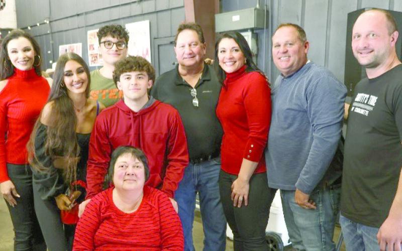 Pictured, from left: Melissa Cuccia, Eva Cucia, Evan Cuccia, Nick Robin, Lori Cuccia (sitting) Anthony Cuccia, Natasha Robin, Kevin Hargis, and Scott Cuccia. Photo by Jim Pennison