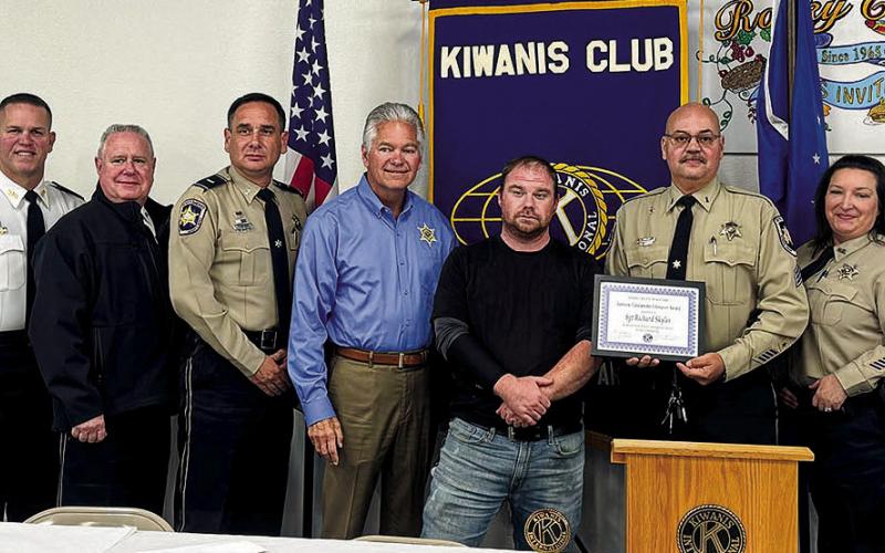 SBSO Sgt. Richard Skyles has been named the recipient of the Kiwanis Club of St. Bernard-Arabi Sam- mie Catalanotto LifeSaver Award for saving a man’s life. At the presentation are, from left to right: Capt. Richard Barr, Maj. Daniel Bostic, Col. Adolph Kreger, Lt. Leander Morgan, Sheri James Pohlmann, Earl Maugham, Sgt. Richard Skyles, Dep. Angee Skyles, and Kiwanian Ellis Fortenberry.