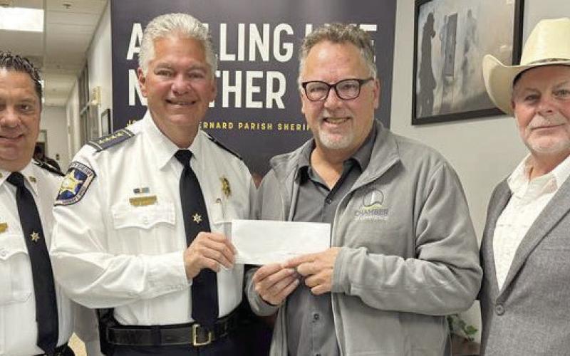 Pictured, from left: Col. Chad Clark, chief of detectives; Sheriff James Pohlmann, Chris Haines of the Meraux Foundation, and St. Bernard Parish President Louis Pomes.
