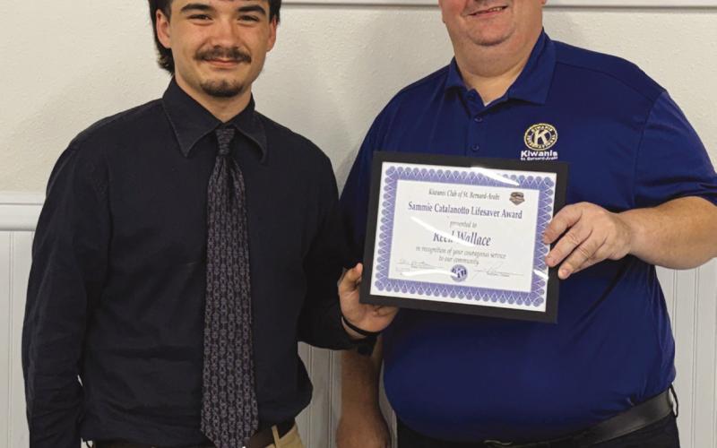 St. Bernard Parish Sheri 's O ce summer intern Reed Wallace, left, is presented with the Kiwanis Club of St. Bernard Sammie Catalanotto LifeSaver Award by Kiwanian Ellis Fortinberry.