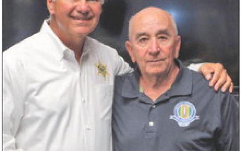 St. Bernard Sheriff James Pohlmann, left, accepts a $100 donation for the Junior Deputy Academy from Hilton Preau, president of the Vietnam Veterans of America, St. Bernard Chapter 550.