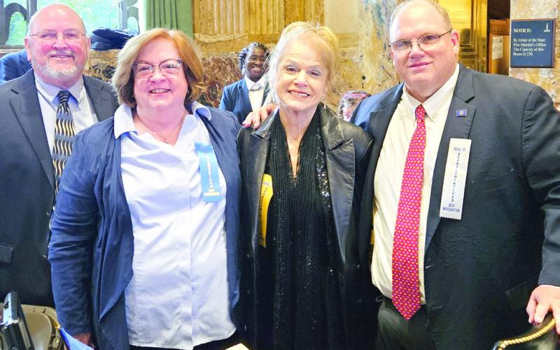 Newly sworn in District 103 State Representative Mike Bayham poses for a photo with family members at the swearing in ceremony on January 8.