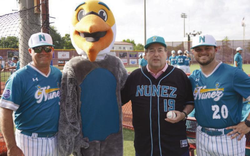 Lt. Gov. Billy Nungesser joins Nunez Baseball Coaches Glenn Powell, left, Alex Powell, right, and Bernard the Pelican after throwing the ceremonial . rst pitch for the Pelicans April 24 ahead of a game at Noel Suarez Stadium in Chalmette.