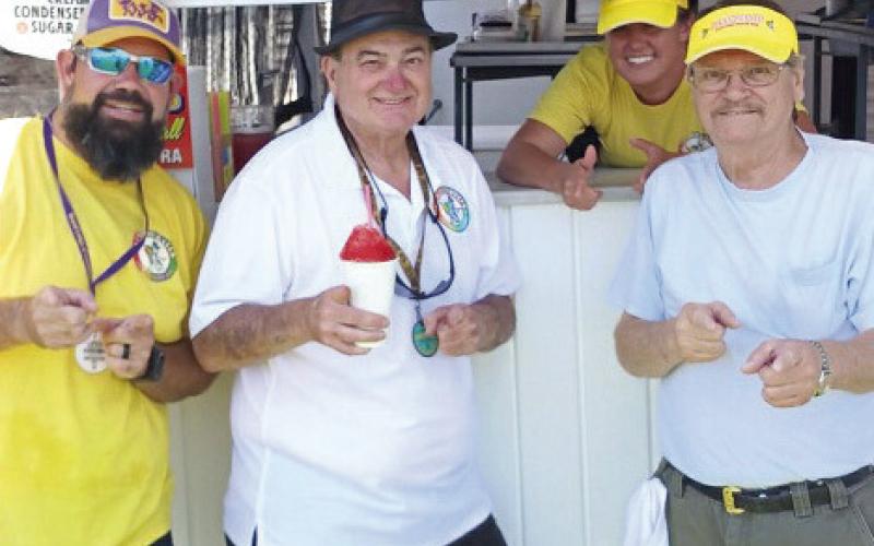 AJ Duvio of St. Bernard is celebrating 40 years at Jazz Fest with his snowball stand.