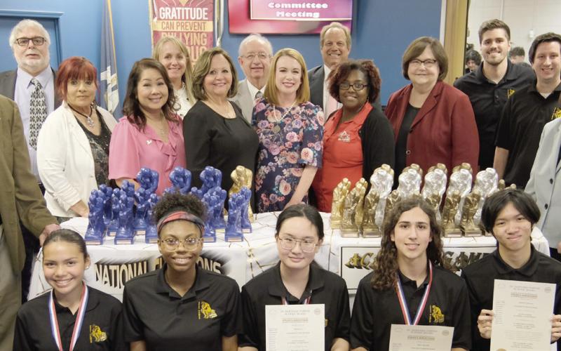 Pictured in the front row, from left: Academic Games Athletes Kimberly Quintanilla, Tania White, Selina Li, Trey Meyers, and Kenny Quach. Middle row: Donald Campbell, Rosiland White, Kelly Le-Bowman, Diana Dysart, Katherine Lemoine, Keisa Rodney, Doris Voitier, and Mary Lumetta. Back row: Millie Harris, Henry Rodriguez III, Carly Jackson, Joseph Long, Sean Warner, Jonathan Palazzolo, Ryan Gregoire, and Maggie Roussell.