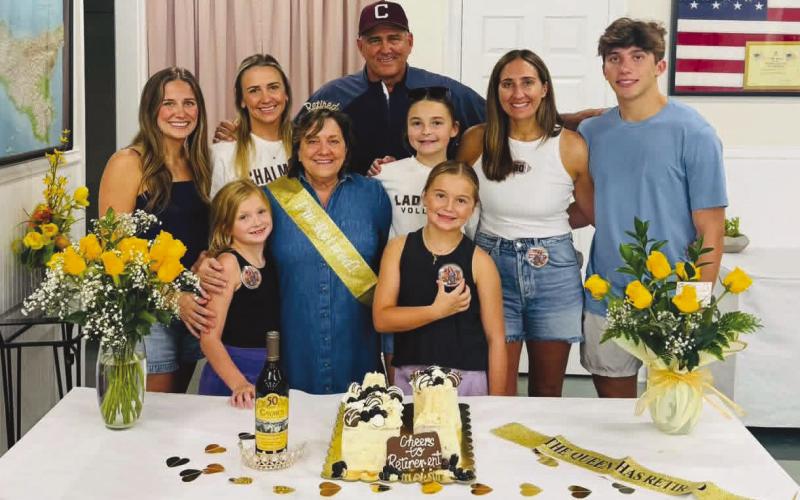 Laurie McInnis is surrounded by her family in celebrating her retirement from the public schools where she served for years as the District Nurse.