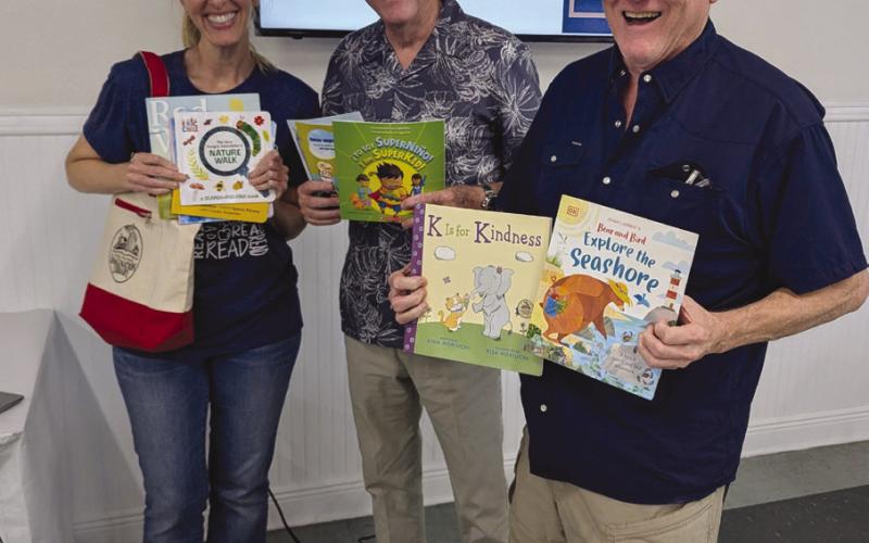 Kiwanis members Tracy Duplantier, Mike Pechon, and Mike Chutz are Ready for Reading.