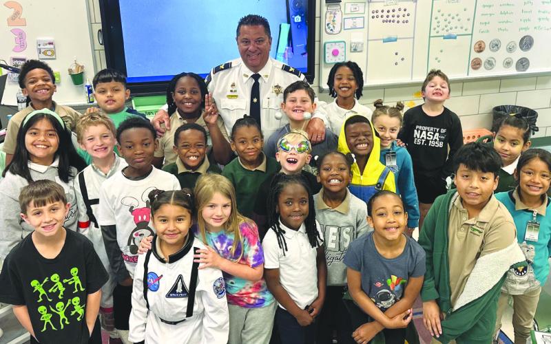 Col. Chad Clark, commander of the SBSO’s Criminal Investigations Bureau, visited with and read to Arabi Elementary students during Literacy Week.