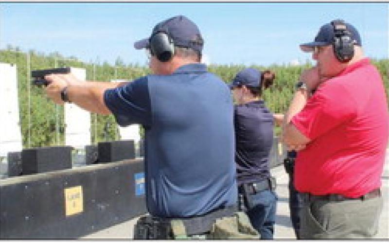 Dep. Jules Martin, who recently became SBSO’s newest Certified Firearms Instructor, works with deputies as they train at the Sheriff’s Office shooting range.