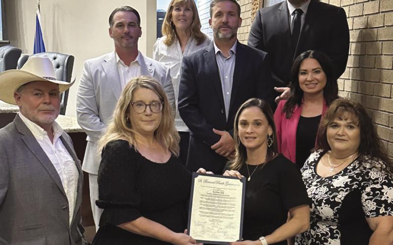 Parish President Pomes and council members present Domestic Violence Awareness Month proclamation to representatives from the St. Bernard Family Domestic Violence Center.