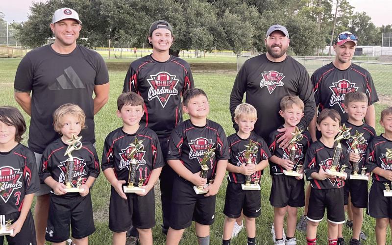 The Versailles Cardinals 5-year-old and 6-year-old Flag Football team were recently named champions! Team members are, first row, from left: Rowan Molina, Marcelo Molina, Jaxx Ellis, Lawson Argo, Trenton Riggio, Ronnie Hebert, Lance Taisant, Jay Gernados and Nathan Farley. Back row, from left: Coach Tommy Riggio, Coach Donald Ellis, Head Coach Ronnie Hebert and Coach Patrick Farley.