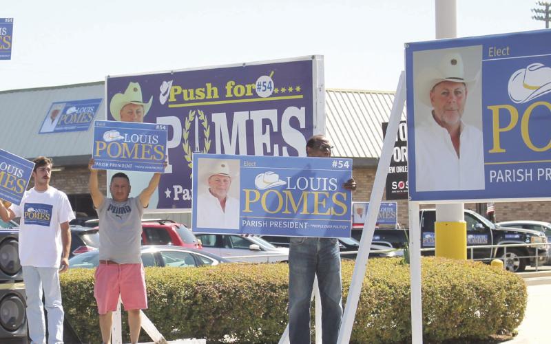 Supporters of Louis Pomes wave signs in support of the candidate for St. Bernard Parish President. Photo by Amber Prattini Wallo