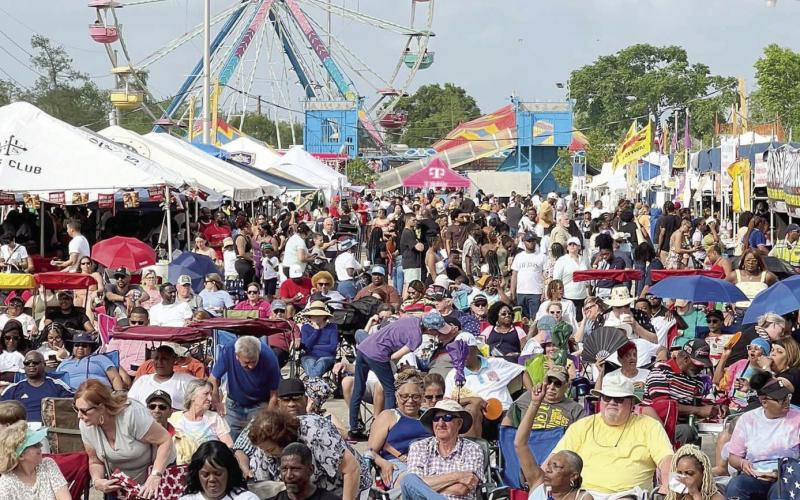 Louisiana Crawfish Festival crowd gathers before the main stage for a live music performance.