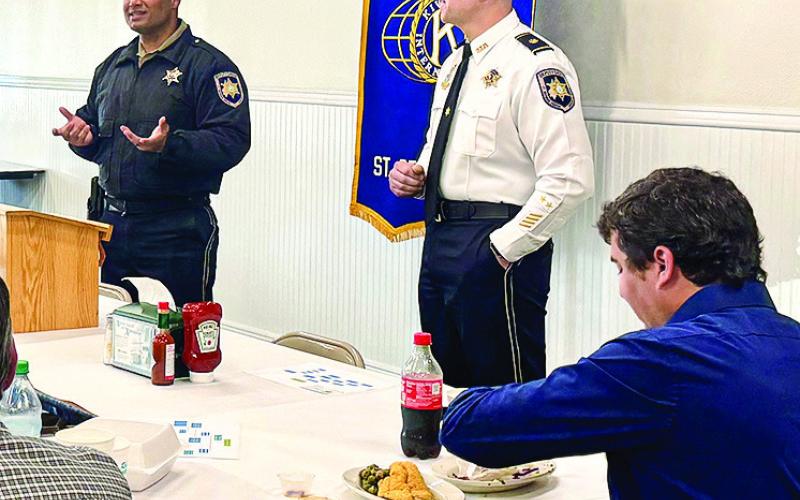 Maj. Daniel Bostic, commander of SBSO's Special Investigations Division, right, and Narcotics Agent Patrick Clark explain to members of the Kiwanis Club what the department's K-9 Unit does to assist the department with drug detection.