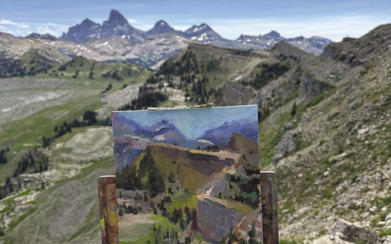 Sabrina Schmidt while visiting her daughter Hana, who lives in Wyoming, took a few minutes to capture the mountain vista on canvas. Sabrina had just left painting the Grand Tetons in Idaho in a competition.