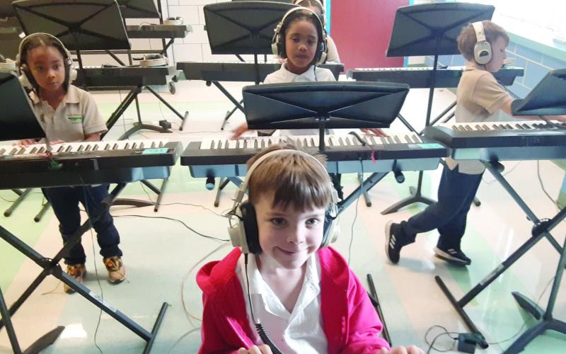 Music students from Arabi Elementary using their new headphones.