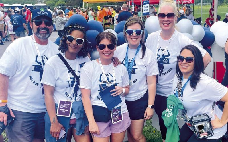 Community Center of St. Bernard's Board Members and sta enjoying the post-race afterparty at the 2024 Crescent City Classic. Photo Credit: Lori Noto