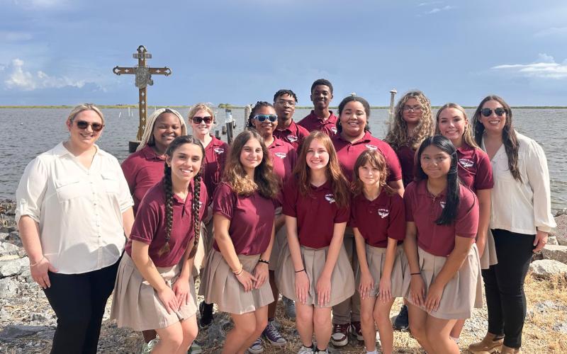 Chalmette High School Voices pose for a photo after singing the National Anthem during the ceremony.