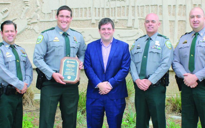Pictured, from left: Lt. Adam Young, Corporal Blaine Wagner, Richard Fischer, Col. Chad Hebert and Capt. Tim Fox.