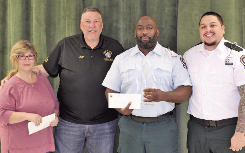 The Knights of Columbus Archbishop Rummel Council 5747 named Acadian Ambulance Paramedic Kevin Jordan the 2022-23 Paramedic of the Year. Pictured, from left: Knights of Columbus Ladies Auxiliary President Kim DeLuca, Knights of Columbus Grand Knight Jeffrey Caruso, Paramedic Jordan, and Acadian Ambulance Operations Supervisor Brivan Garcia.