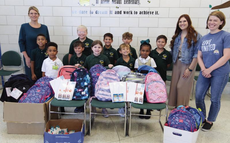 Arlene Meraux Elementary School front row: Students Kole Brasley, Oliver Brown, Laurelai Readhead, Blayne Bailey, Kassidy Brasley. Back Row: Principal Natalie Albers, students Kaysen Burrell, Avynleigh Crawford, Lucas Tortorich, Bentley Bailey, Mason Newton, Assistant Principal Maggie Roussell, and United Way's Brittany Elder.