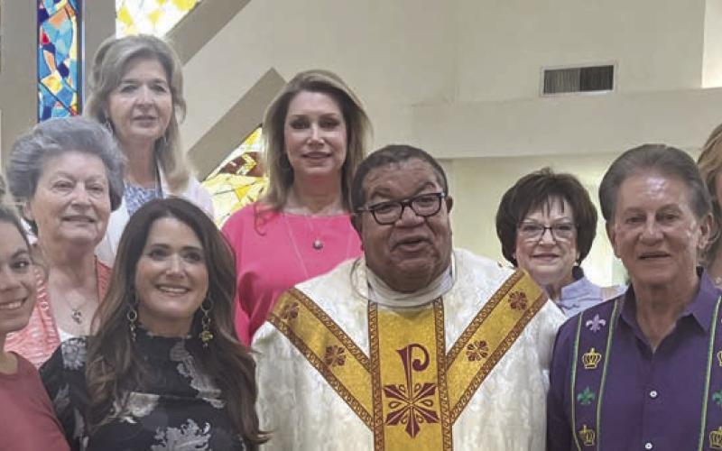 The Krewe of Lourdes recently presented a check to Our Lady of Lourdes Catholic Church from the proceeds of the 2023 ball and supper dance. Pictured left to right are Capatin Carlee Nunez, Queen Denise Clark, Fr. Kenneth Woods, King Lee Giorgio, Lena Nunez, Phyliss Diecedue, Cheryl Georgusis, Nora Eagen, and Melanie Cantatella.