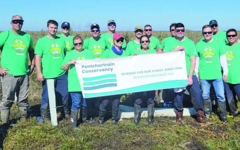 Pictured are the volunteers who planted 500 bald cypress, live oak and water tupelo seedlings in the Bayou Dupre central wetlands area of St. Bernard Parish on Nov. 11. The trees will help enhance the natural coastal wetland buffer, mitigate effects of storm surge.