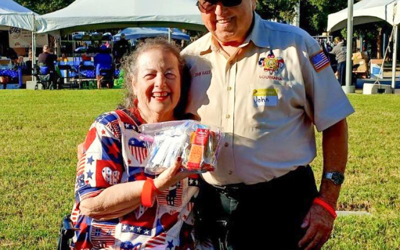 Recently the Southeastern VA Medical Center in New Orleans hosted a Stand Down. Shown distributing food &amp;amp; personal care products are Chalmette resident Sandra Reuther (Arnaudville VFW Post Auxiliary 5153) and Marrero resident John Kass (John McDonogh VFW Auxiliary 3121). Sandra is accepting donations for the Christmas party for homeless veterans, who always request deordant, socks and band aids.