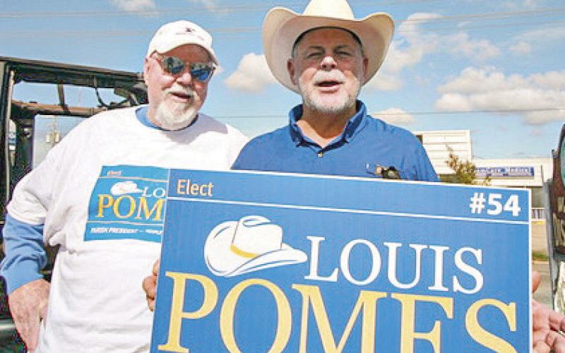 Campaign manager Billy Shultz and candidate Pomes doing midday sign waving. Photos by Jimmy Delery
