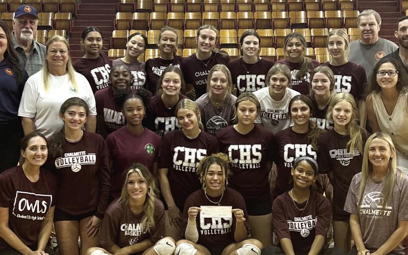 Pictured are the members of the CHS Volleyball Team and members of the St. Bernard Sports Hall of Fame Board of Directors.