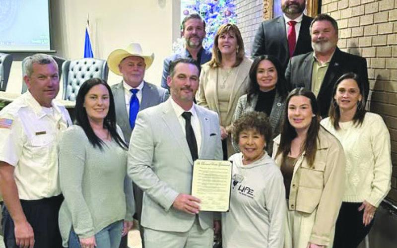 Representative with The Blood Center Suzie Potter accepts Proclamation naming January 2026 National Blood Donor Awareness Month in St. Bernard from council member and parish president Louis Pomes.