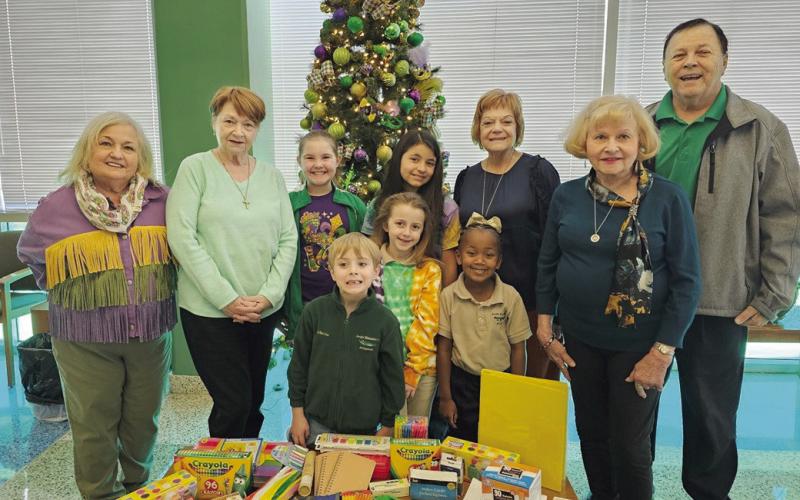 St. Bernard Retired Teachers donate school supplies to Arabi Elementary School. Pictured in the front row, from left, are students Dawson Dautrive, Vega Smith and Raelyn Jackson. Back row: Principal Carla Carollo, Cindy Kooke (SBRTA Vice-President), students Gabrielle Falgout and Audrey Damico, Rosemary Gioia (SBRTA Treasurer), Michaele Lux (SBRTA Secretary) and Paul Grethel (SBRTA President).
