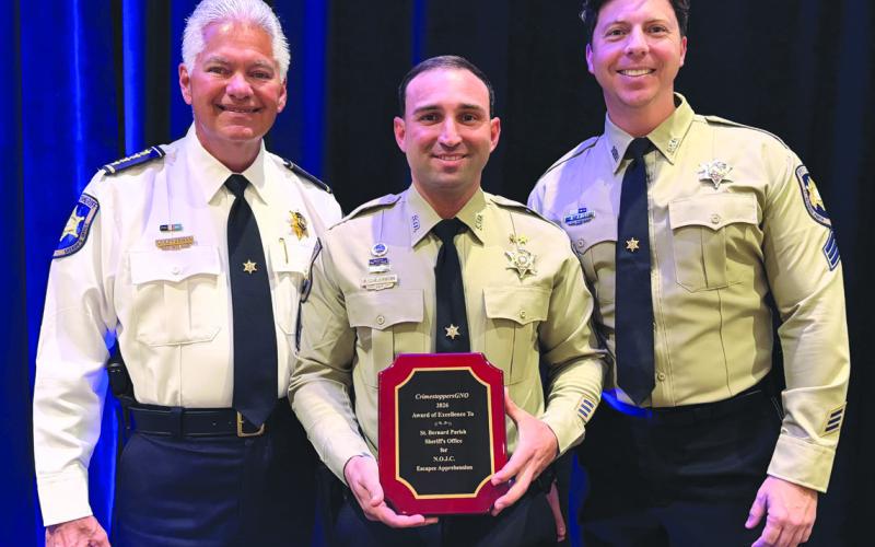 St. Bernard Sheri James Pohlmann, left, stands with Special Investigations Division Sgt. Richard Scheuermann, center, and Sgt. Jonathan Smith, right, after they were honored at the 41st Annual CrimestoppersGNO Awards Luncheon for their partnership in handling anonymous tips that developed into critical intelligence assisting in the arrest of Orleans Parish Prison escapees.