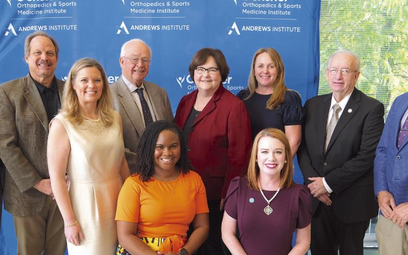 Dr. James Andrews pictured here with (from left) Ray Lauga, Sean Warner, Doris Voitier, Carly Jackson, Joe Long, Dr. Deryk Jones, Alanna Fast, Dr. Shannon Goode, and Katherine Lemoine.