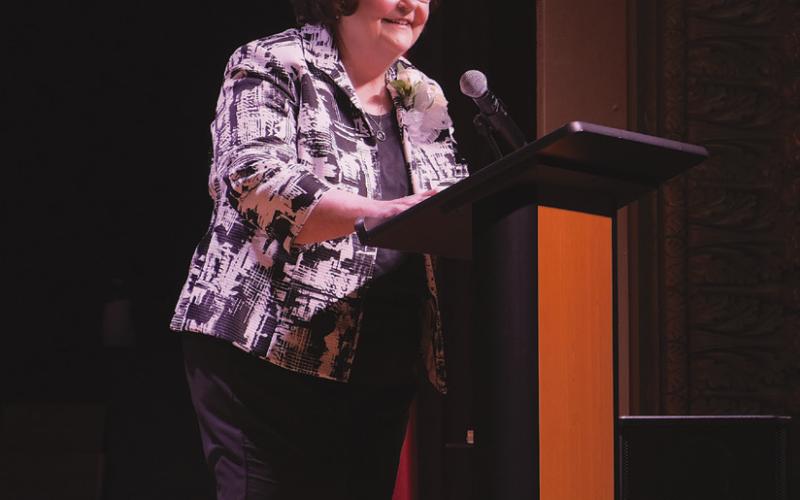 In her speech, Voitier re. ected on her many years of service. “Together, we didn't just rebuild buildings. We brought back hope."