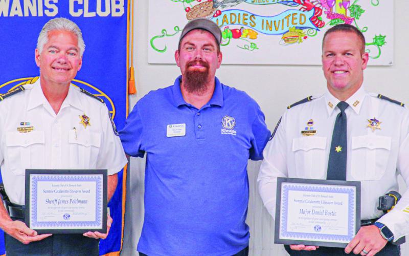 Pictured, from left: Sheriff Jimmy Pohlmann, Kiwanis President Nick Koepp and Major Danniel Bostic.