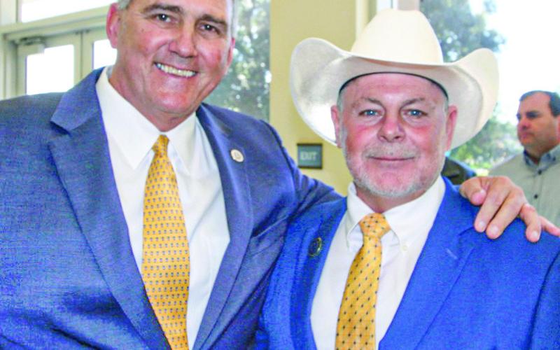 Outgoing Parish President Guy McInnis with the new St. Bernard Parish President Louis Pomes.