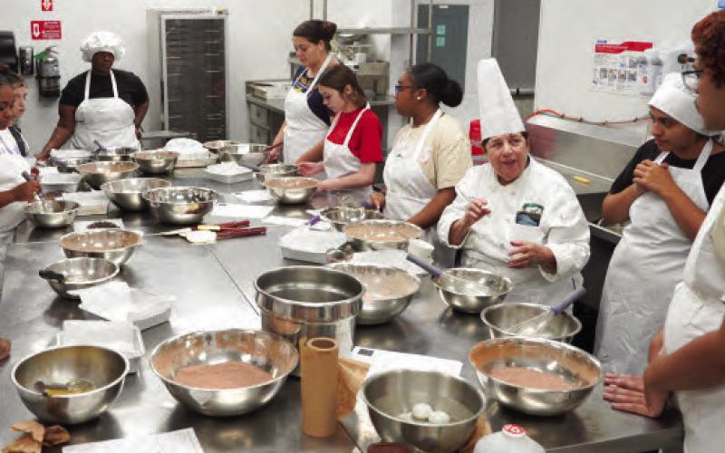 Nunez Culinary Professor Chef Ruth Varisco leads a baking class during the Fall 2024 semester. Nunez will offer Mini-Session B Oct. 15-Dec. 11, with more than 20 courses available online and more than 40 courses overall. Registration for Mini-Session B is open now at Nunez.edu.