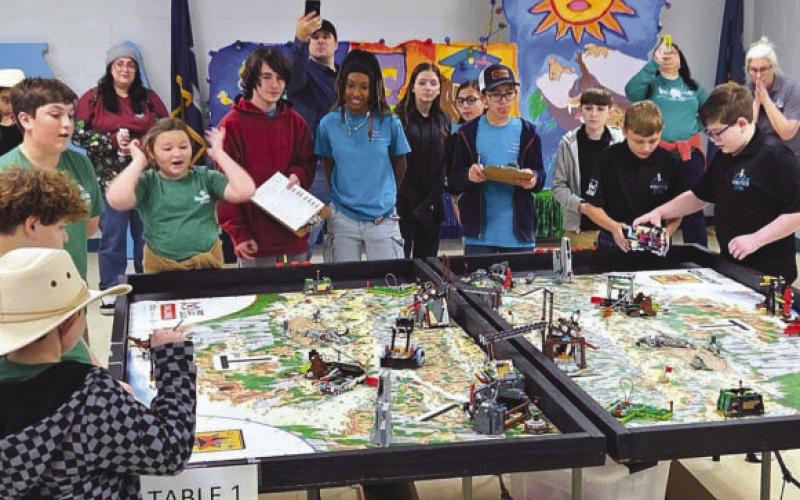 Students from Nunez Community College Robotics Team 57245, in black, and Our Lady of Prompt Succor (OLPS) School’s Patriots, in green, participate in the college’s inaugural FIRST LEGO League Tournament in December 2025. Three Nunez teams and OLPS advanced to state competition in February at Jesuit High School.