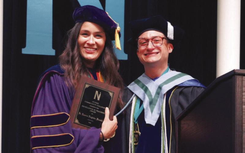 Dr. Lauren Englade-Franklin, professor of chemistry, is presented with Nunez Community College’s 2026 Excellence In Teaching Award May 20 during Nunez’s 34th Commencement Ceremony at the Sigur Center in Chalmette. Dr. Franklin was presented with the award onstage by the 2025 winner, Dr. Charles Miller, associate professor of sociology.