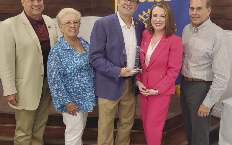 Rotary Board Members Sean Warner, Brenda Break. eld, and Joey DiFatta recognize Dr. Katherine and Barry Lemoine for their service to St. Bernard Parish.